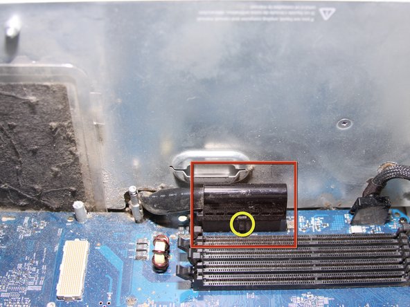 Image 1/3: Unplug the black rectangular plug with a rounded top by pulling outwards.