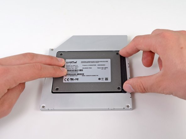 Image 2/2: Reconnect any cables you have removed from the original optical drive onto the optical bay enclosure.