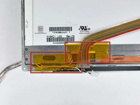 Image 1/2: Peel the three green antenna ground straps off the copper tape along the bottom edge of the LCD.
