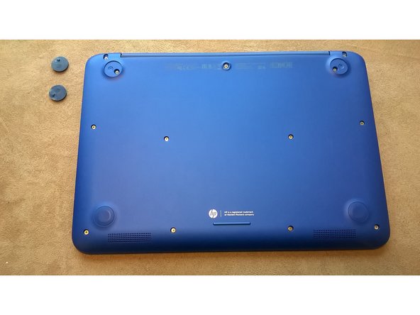 Beneath each pad is a screw. Make sure you remove all of the pads.