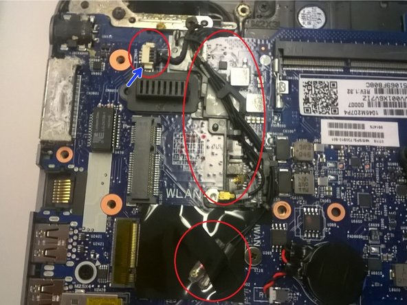 Image 1/1: The plug in the top left is actually for the speakers, not the wireless card, but is wedging the wireless cables into their plastic guide.