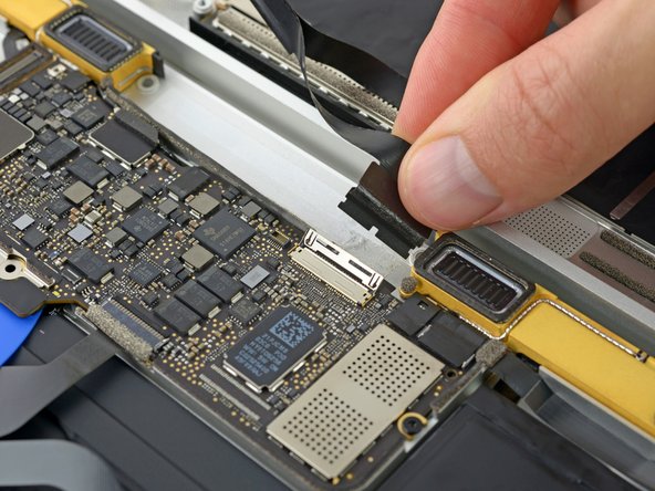 Disconnect the display cable by gently pulling it straight out of its connector.