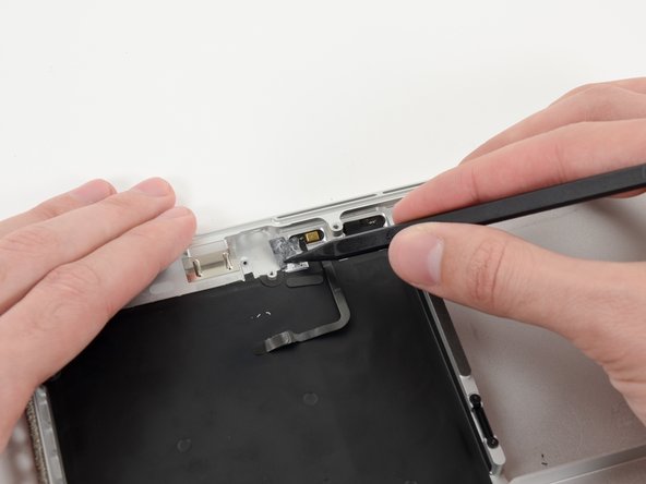 Image 2/3: Grasp the piece of tape with a pair of tweezers and remove it.