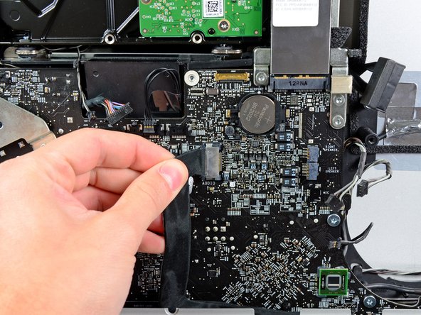 Image 1/2: Do not pull the cable toward yourself (away from the front face of the logic board) as you disconnect it.