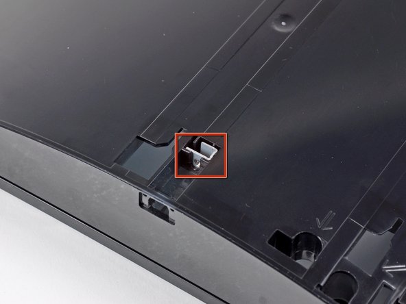 Be sure to keep track of the small metal bracket loosely held in the top cover, if equipped.