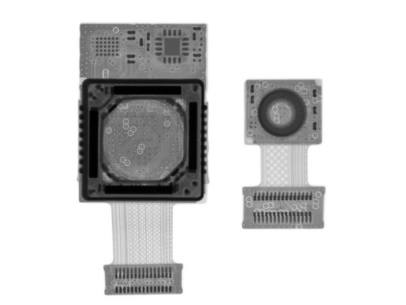 The wee camera next door is the front-facing camera; just a simple lens and image sensor, with no OIS mechanism.