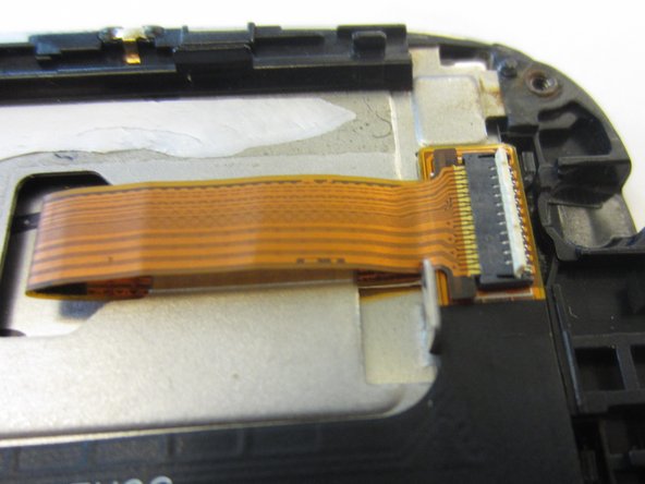 Disconnect gold ribbon cable connecting screen to logic board by pulling cable out gently.