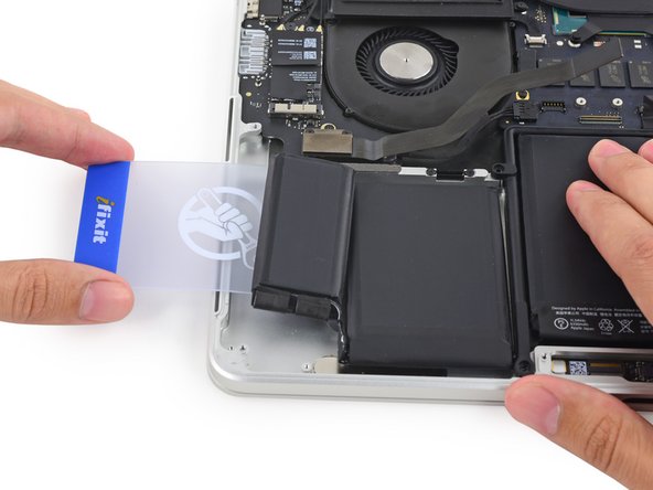 Image 3/3: If you encounter significant resistance, stop and use the iOpener to re-heat the battery cells.