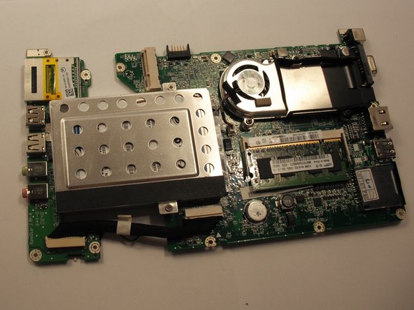 Turn the motherboard over so the RAM is facing up.