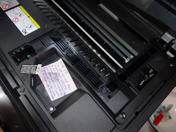 Unplug the ribbon cable and slid it out