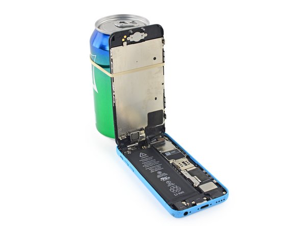 Image 2/2: In a pinch, you can use an unopened canned beverage to hold the display.