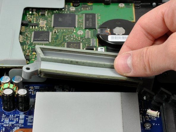 Image 2/2: Lift the fan duct out of the midplane.