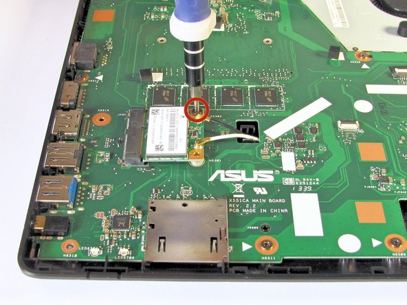 Use the Phillips #0 Screwdriver to unscrew the 3.2 mm Phillips #0 screw which attaches the WiFi card to the motherboard.