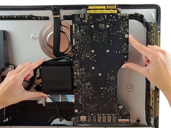 Image 3/3: The I/O boards at the bottom of the logic board will be the greatest challenge. It is recommended to pull gently to avoid any damage.