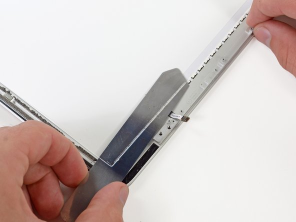 Image 1/3: Erring on the side of caution, we proceded very slowly with our modified [product|IF145-130|iSesamo] opening tool and removed the plate.