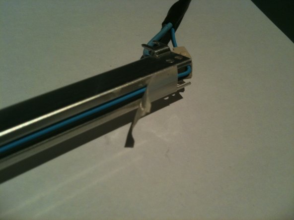 Image 1/3: Carefully remove about 15-20mm of heat shrink from the CCFL cable to allow the end cap to be removed, making sure you '''DO NOT''' cut or nick the wire insulation.