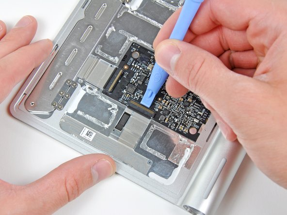 Disconnecting the ribbon cable in the Magic Trackpad teardown