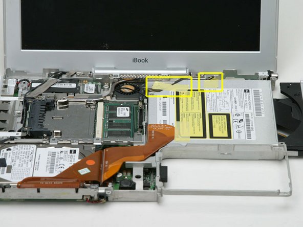 Image 1/1: Open the optical drive using a straightened paperclip (if it's not already opened).