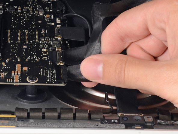 Image 1/2: Lift the display up enough to have easy access to the connector, but not so much that you stretch the cables and stress their connections (about 8").