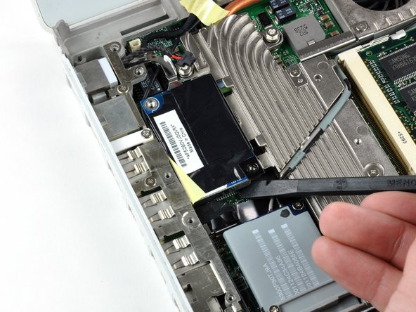 Image 1/1: When replacing the modem, seat the shield first, and then connect the modem and press it firmly into the shield, making sure that it is connected to the logic board.