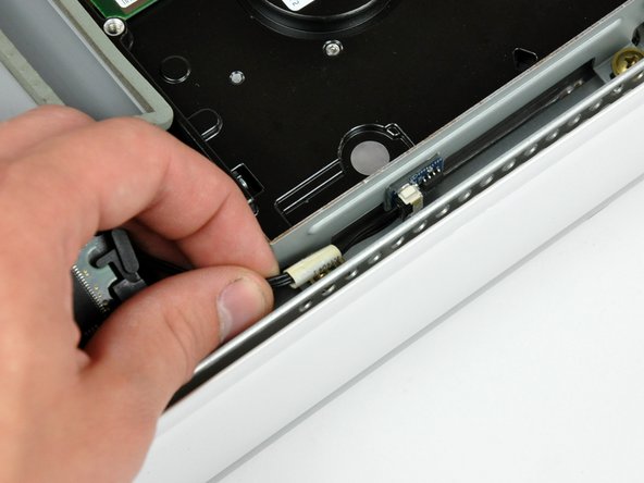 Image 1/1: During reassembly, plug in the hard drive thermal sensor before lowering your new hard drive into the midplane.
