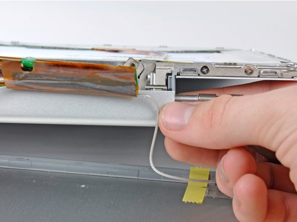 Image 2/2: Remove the clutch cover from the device.