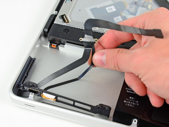 Image 2/3: Lift the hard drive and IR sensor assembly out of the upper case.