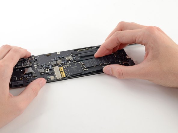 Image 2/2: When reinstalling the SSD, be sure it is properly seated before reinstalling its retaining screw.