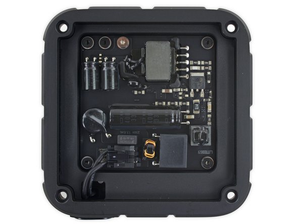 Image 2/3: The redesigned power supply is rated at 12V at 0.917A. Compare that to the [https://www.ifixit.com/Teardown/Apple+TV+3rd+Generation+Teardown/8293#s33183|3rd-gen Apple TV's main reactor|new_window=true], which pumped out 3.4V at 1.75A.