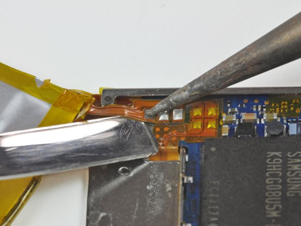 Image 2/2: Beware of overheating the board and the cable. Only hold the tip of the iron against the pad long enough to let the solder melt. Excess heat buildup has the potential to ruin the logic board or melt the ribbon cable. Consider letting the board cool off between melting each solder pad.