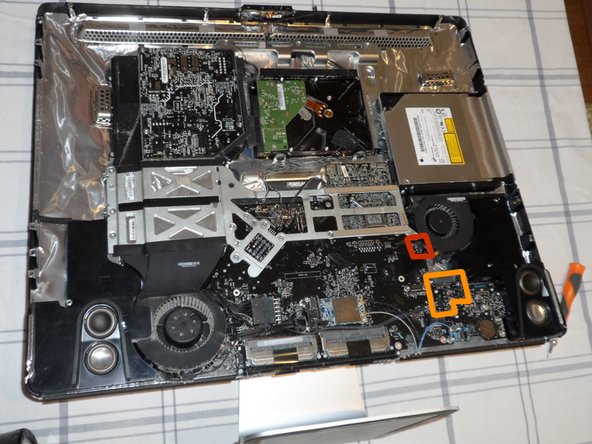 Image 1/3: You have four plugs to disconnect at this location: SATA bus, microphone, and the left and right speaker cables.