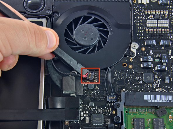 Image 1/1: Remove the soft padding that may be on top and gently pull the connector up out of its socket on the logic board.
