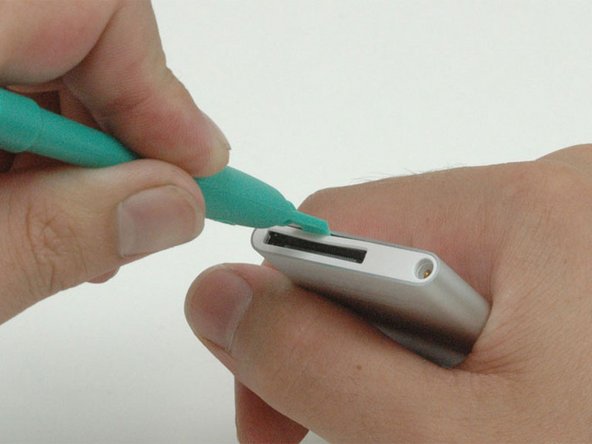 When removing the bottom bezel, be sure not to bend the plastic surrounding the dock connector.