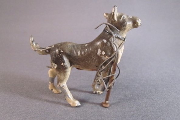 dog figurine fixed through home repair