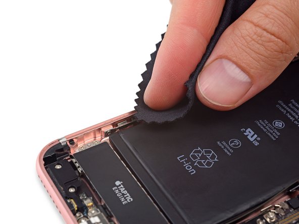 Using a lint-free cloth (or coffee filter) with a bit of isopropyl alcohol, clean the areas of the case and rear display where you removed the old adhesive.