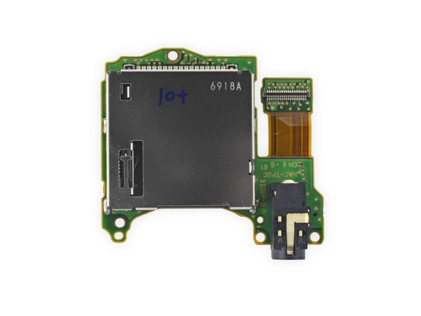 Image 3/3: So we pop out the game card reader, and attached headphone jack.
