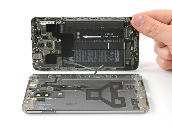 No other tools needed, and we're in … looks like the inside of a phone to us! There is one flex cable which still connects the back cover with the main assembly of the Mate 9.