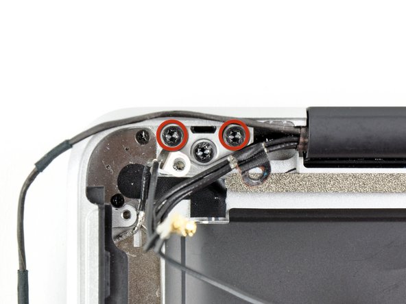 Image 1/1: We purposely have you leave one screw attaching the display to the upper case to aid in future steps.