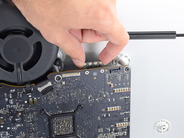 Image 2/3: When reinstalling the card, be sure it is properly seated before reinstalling its retaining screw.
