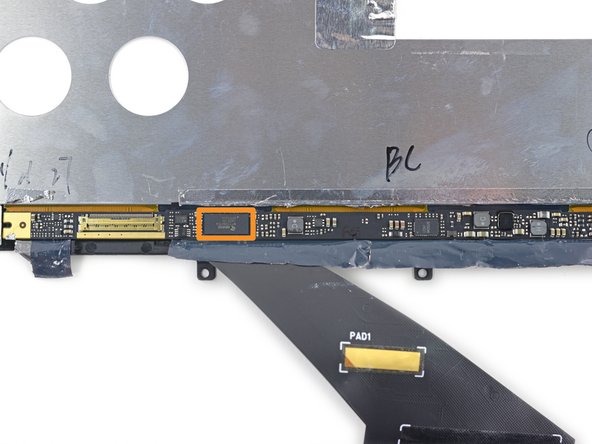 The display driver board lives under some foil tape at the bottom of the panel.