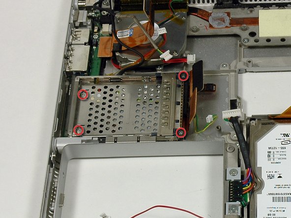Image 1/1: The two longer screws go on the right side of the card cage.