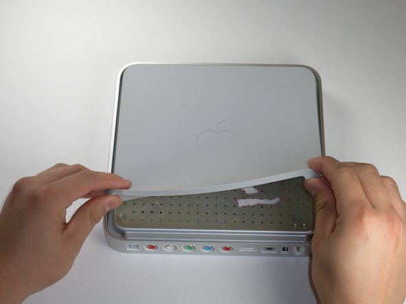 Image 1/1: You need to remove the rubber base to get access to the screws.