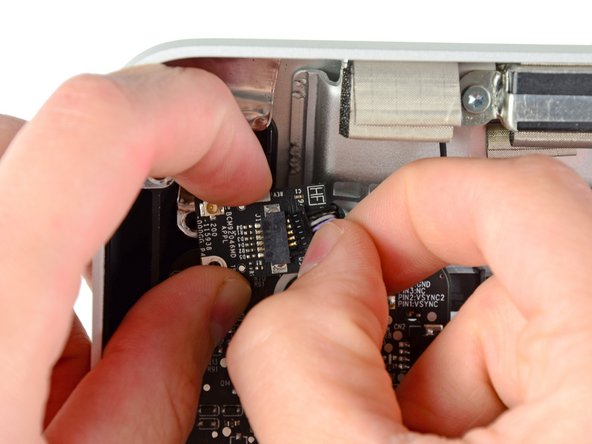 Image 1/1: Remove the Bluetooth board from your iMac.