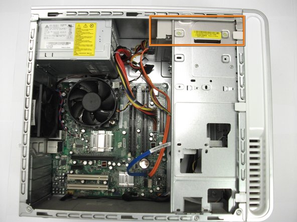 Image 1/1: Locate the CD/DVD drive in the upper-front corner of the case.