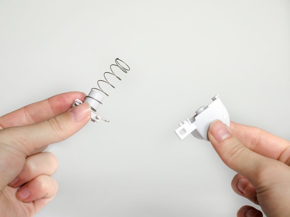 Pull the metal clip from the trigger.