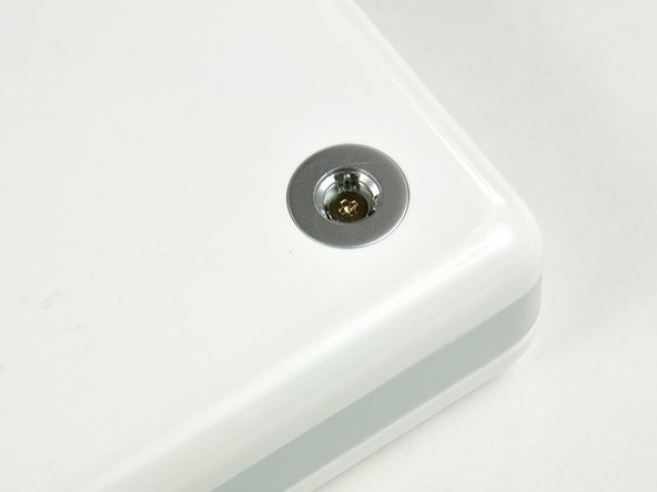 Image 1/1: One screw is underneath each bumper (three total).