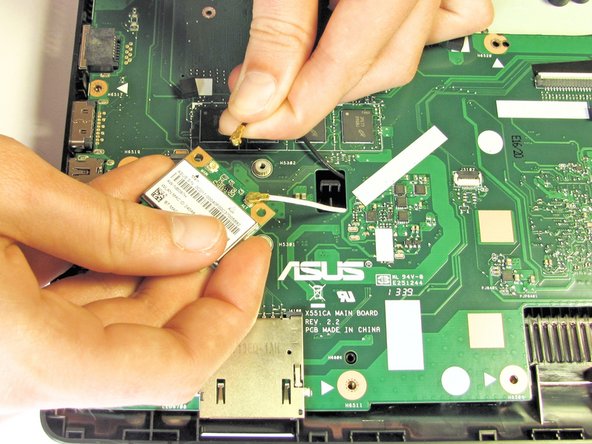 Remove each of the two small antenna connections by disconnecting one wire at a time. Each wire should easily unsnap from the Wifi card.