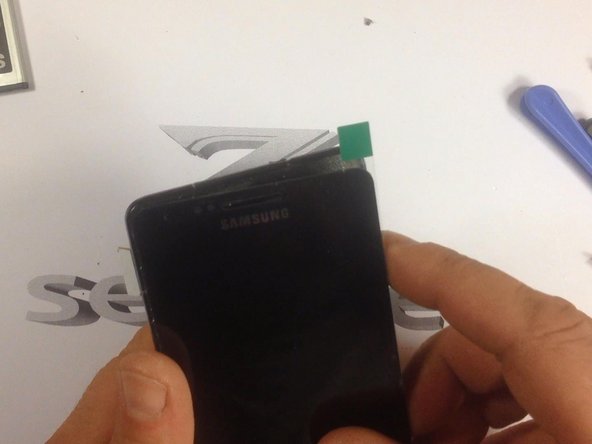 Many times the spare parts come without adhesive tape. In this situation you'll need to install double sided adhesive tape yourself. Also you can easy find adhesive sticker exactly for the model.