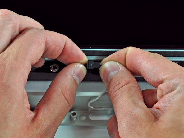 Image 1/1: For the front bezel to sit properly, be sure to tuck the microphone cable and connector into the void next to the camera board.