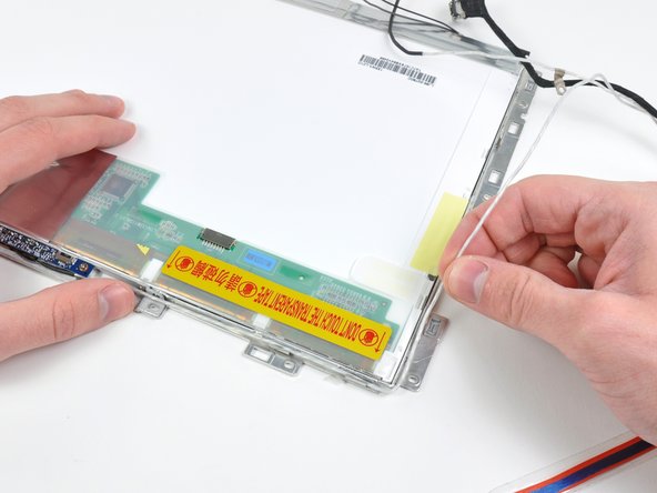 Lift up the display data and iSight cables and move them to the side. It is not necessary to entirely remove these cables from the display assembly.